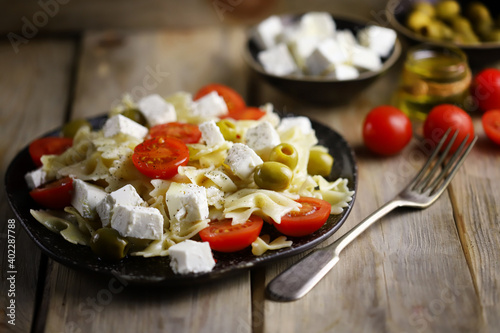 Pasta bows with feta and olives. Italian Cuisine.