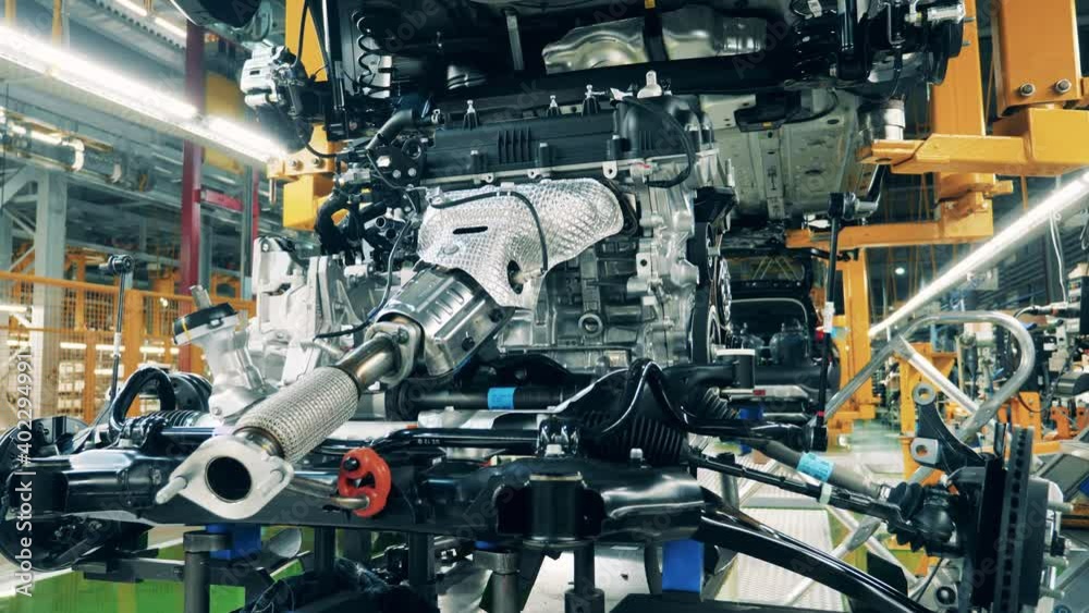 Vehicle body moving along a production line at a car production factory Vehicle body moving along a production line at a car production factory