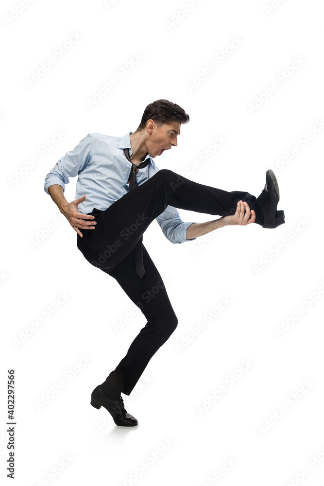 Rockstar. Happy young man dancing in casual clothes or suit, remaking legendary moves and dances of celebrity from culture history. Isolated on white. Action, motion, fame concept. Creative occupation