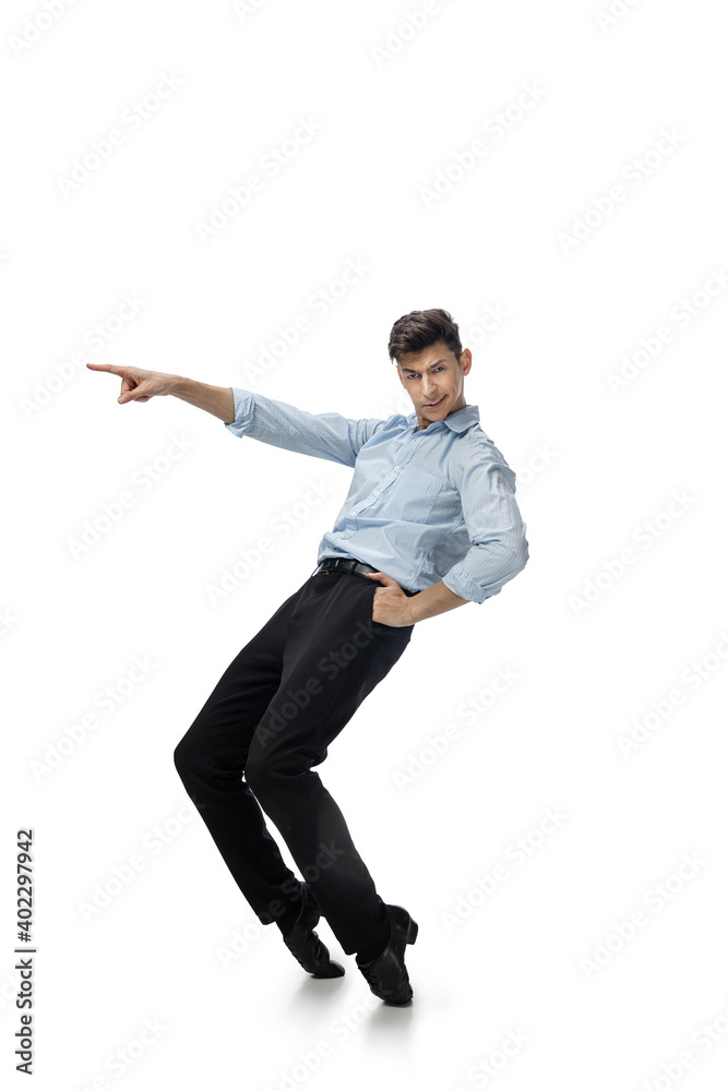 Dance king. Happy young man dancing in casual clothes or suit, remaking legendary moves and dances of celebrity from culture history. Isolated on white. Action, motion, fame concept. Creative Dance king. Happy young man dancing in casual clothes or suit, remaking legendary moves and dances of celebrity from culture history. Isolated on white. Action, motion, fame concept. Creative