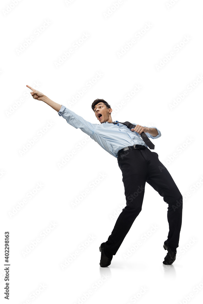 Celebrity. Happy young man dancing in casual clothes or suit, remaking legendary moves and dances of celebrity from culture history. Isolated on white. Action, motion, fame concept. Creative Celebrity. Happy young man dancing in casual clothes or suit, remaking legendary moves and dances of celebrity from culture history. Isolated on white. Action, motion, fame concept. Creative