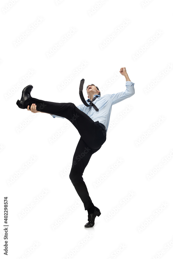 Celebrity. Happy young man dancing in casual clothes or suit, remaking legendary moves and dances of celebrity from culture history. Isolated on white. Action, motion, fame concept. Creative
