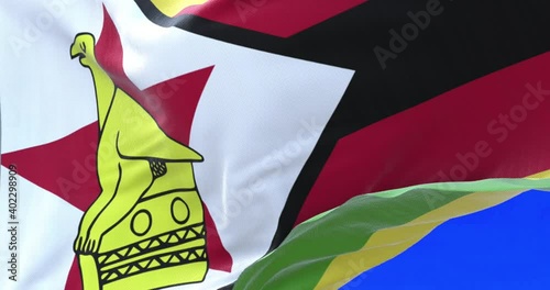 The national flag of Zimbabwe consists of seven even horizontal stripes of green, gold, red and black with a white triangle containing a red 5-pointed star with a Zimbabwe Bird. photo