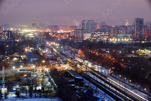 Moscow, Russia. Desember 23 2020: Trains and the Moscow skyline. Ostankino railway platform. © Anna