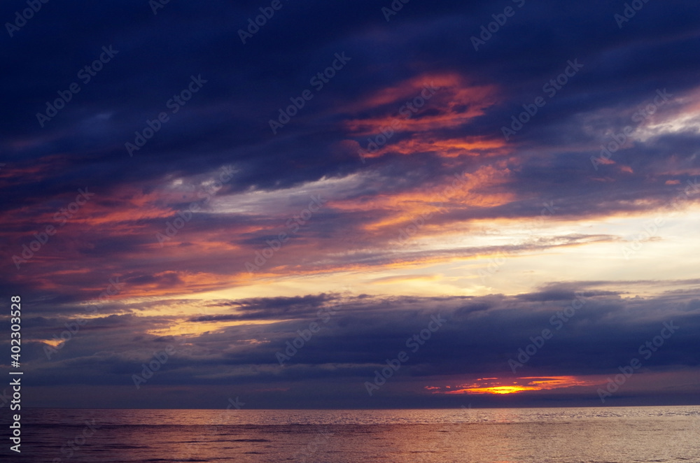 sea sunset with lighted clouds 