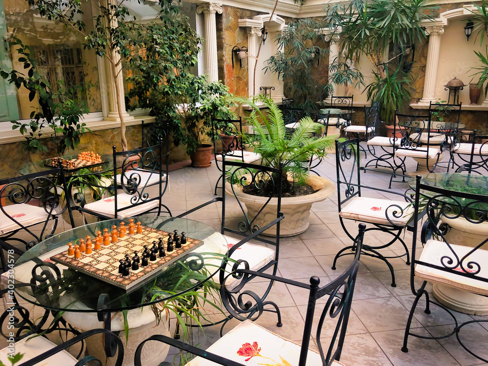 Ταπετσαρία tables games with  chessboards in middle eastern veranda