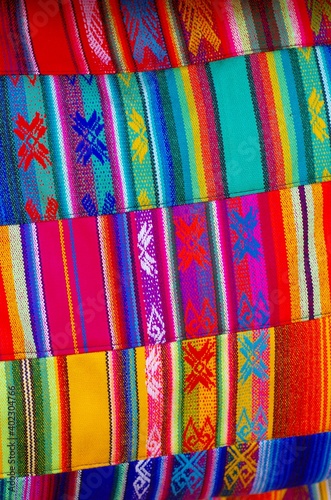 Colorful market with beautiful and unuque handicraft fabric patterns available in Otavalo, Ecuador
