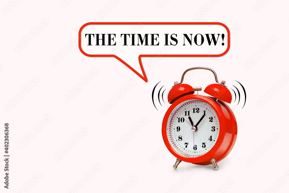 Red alarm clock and text THE TIME IS NOW Red alarm clock and text THE TIME IS NOW