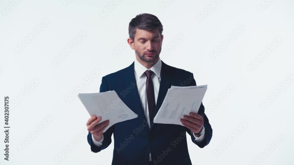 businessman throwing graphs in air isolated on white