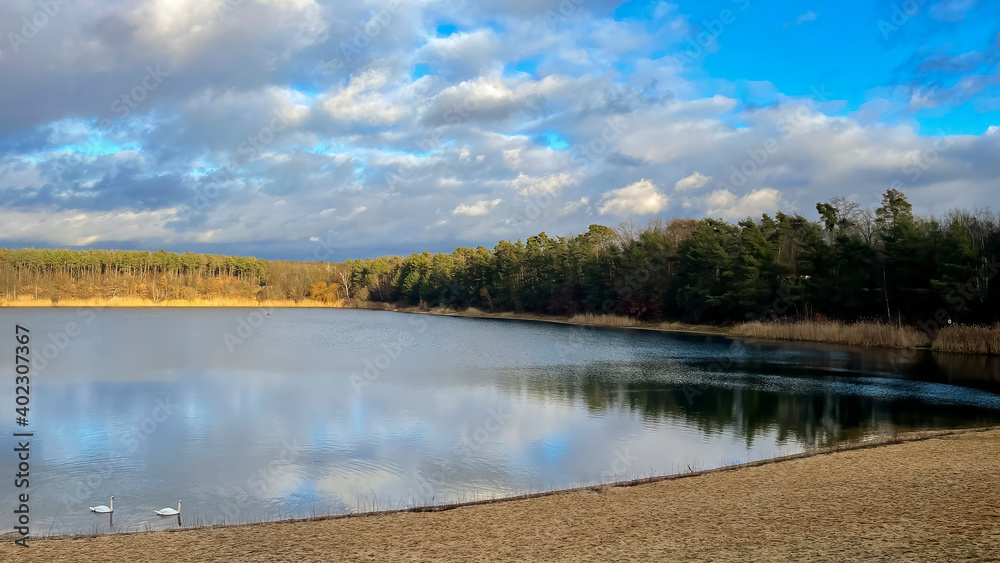 A beautiful little lake next to Frankfurt at a cold but sunny day in winter with beautiful cloudscape. A beautiful little lake next to Frankfurt at a cold but sunny day in winter with beautiful cloudscape.
