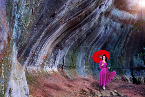 Asian woman visit Pha Khong Cave, a tourist attraction in Phetchabun Province, Thailand. photo