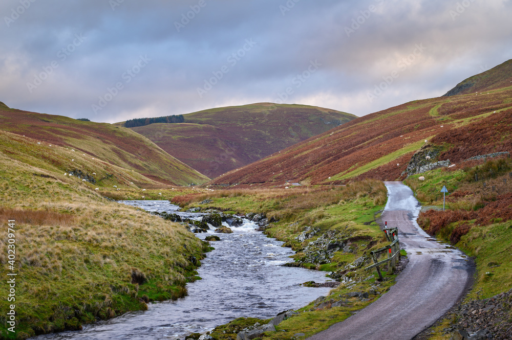 River Coquet flows down Upper Coquetdale, a remote valley located in the Cheviot Hills close to the Scottish Border in Northumberland National Park