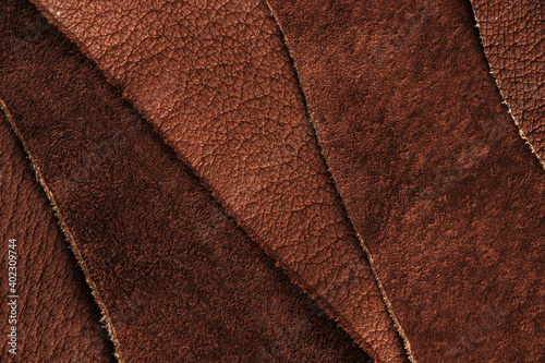 A sample of the texture of natural leather and brown suede. Close-up.

