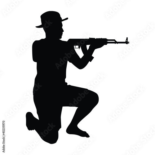 Young boy soldier with weapon silhouette vector