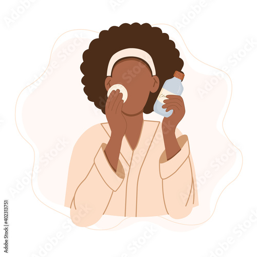 Skin care routine. Black woman in bathrobe applying toner on her face. Cute cartoon hand drawn vector illustration in flat style isolated on white.