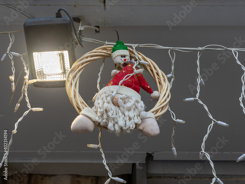 Santa Claus  doll as decoration for Christmas celebration in the shops on Khuri Street in the Haifa city in northern Israel photo