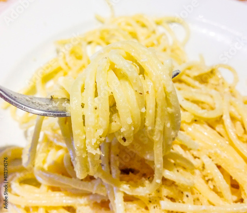 alfredo spaghetti, pasta of the feast in Italy, seasoned with butter, cheese, pepper and herbs