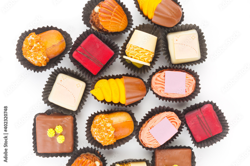 Up view on chocolate praline candies isolated on white background Up view on chocolate praline candies isolated on white background