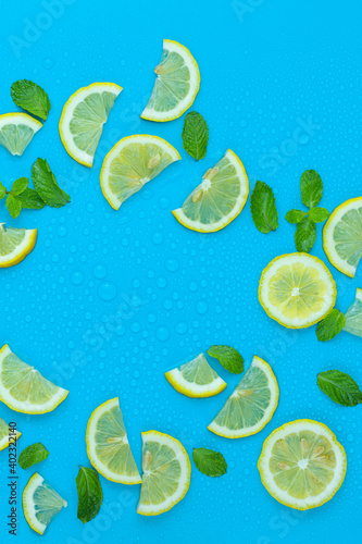 Fototapeta Naklejka Na Ścianę i Meble -  Fresh lemon pattern on a bright color background flat lay