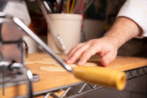 Making Pasta and Tortellini at Home on Wooden Rack and Chrome Pasta Maker