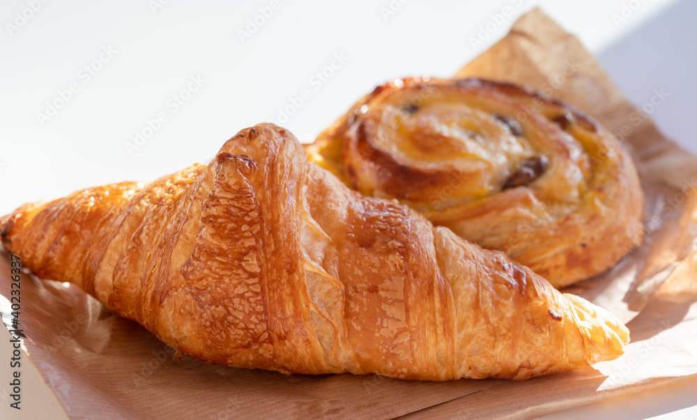 French breakfast in bakery served outdoor, fresh baked croissants and sweet pastry, morning food