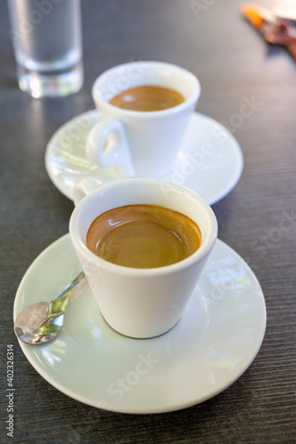 Fototapeta Naklejka Na Ścianę i Meble -  Drinking of strong black espresso coffee on outdoor terrace in cafe