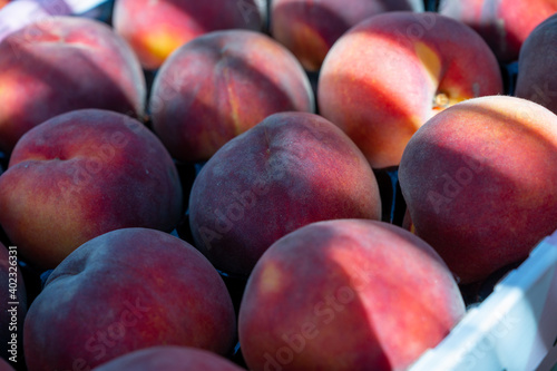 New harvest of big sweet ripe nectarines peaches