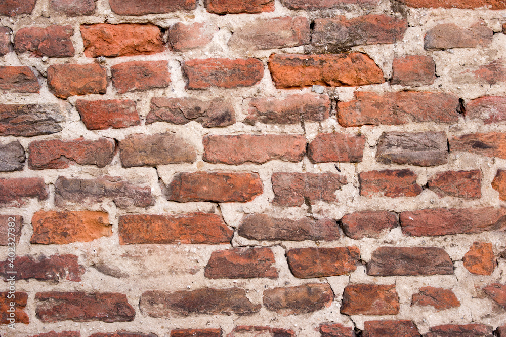 Old stone brick wall with cracks background Old stone brick wall with cracks background