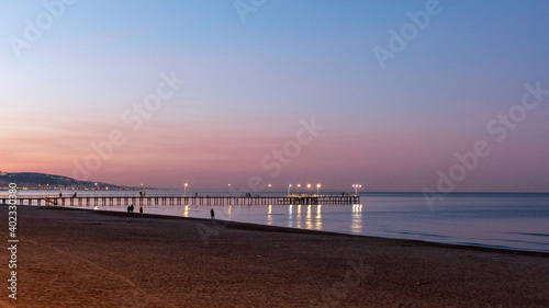 sunset on the beach  pier and sea on the sunset