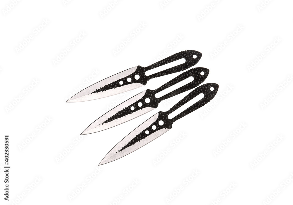 Metal throwing knives isolate on a white back. Ninja weapons. Silent weapon. Metal throwing knives isolate on a white back. Ninja weapons. Silent weapon.