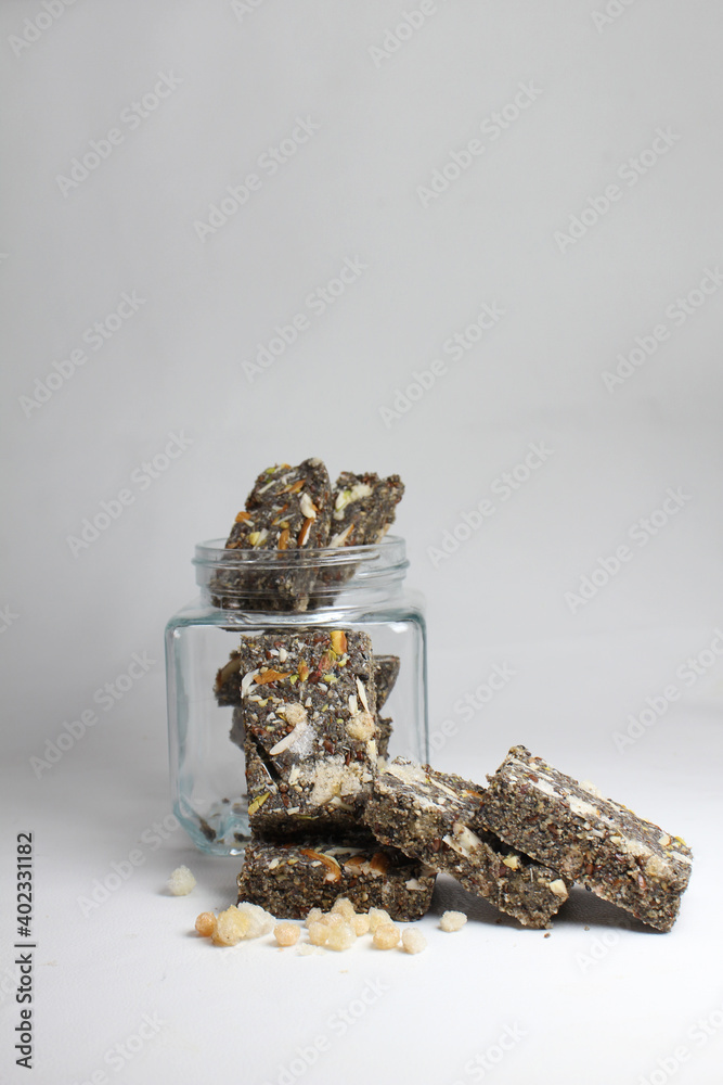 Instant Energy bar made with sesame seeds,flex seeds,jaggery and desi ghee. Instant Energy bar made with sesame seeds,flex seeds,jaggery and desi ghee.