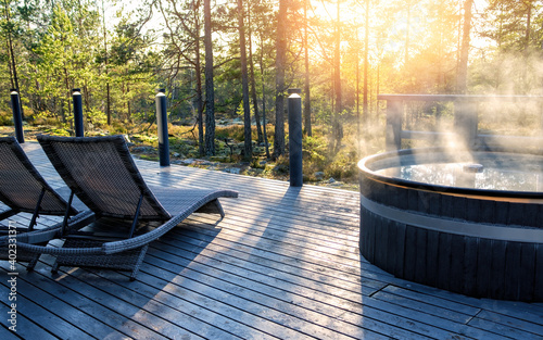 Obraz na płótnie Modern big barrel outdoor hot tub in the middle of forest