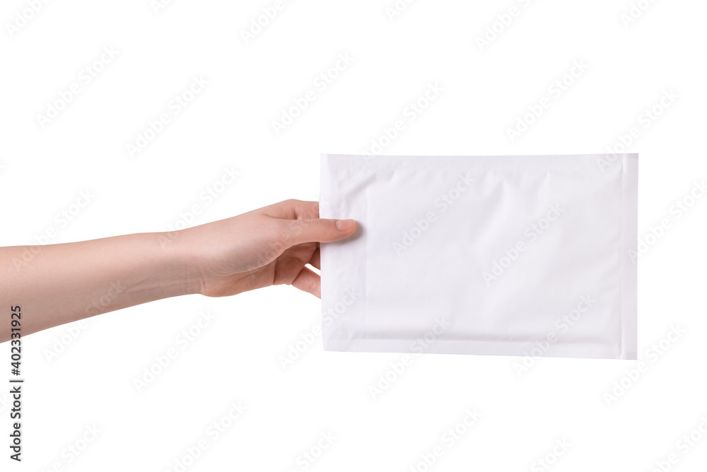 Woman hand holding paper bubble mail envelope Woman hand holding paper bubble mail envelope