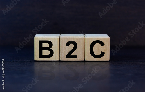 B2C - business to customer symbol. Concept word 'B2C - business to customer' on cubes on a beautiful grey background. Business and B2C - business to customer concept. Copy space.