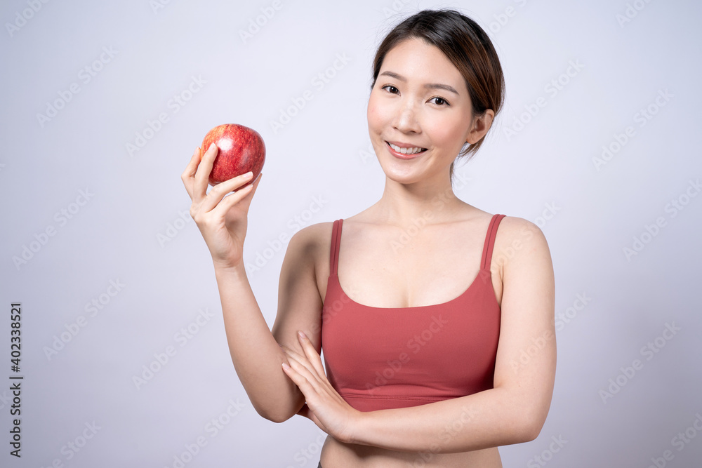 Smiling Asian woman holding red apple Isolated on white background. Smiling Asian woman holding red apple Isolated on white background.