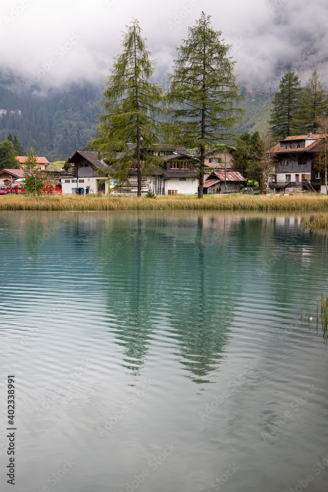 Kandersteg Switzerland - 05.09.2020 View of the village of Kandersteg and Muggeseeli lake Kandersteg Switzerland - 05.09.2020 View of the village of Kandersteg and Muggeseeli lake