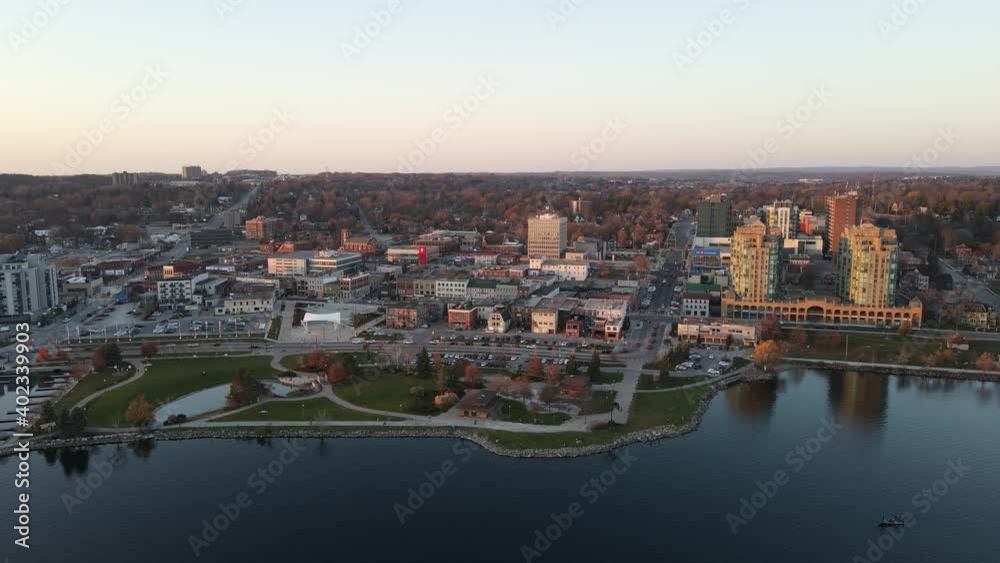 City of Barrie waterfront and downtown aerial drone dolly shot with Lake Simcoe marina, condo buildings, banks, parks and infrastructure. Clear fall day. City of Barrie waterfront and downtown aerial drone dolly shot with Lake Simcoe marina, condo buildings, banks, parks and infrastructure. Clear fall day.