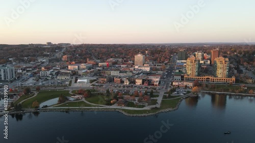 City of Barrie waterfront and downtown aerial drone dolly shot with Lake Simcoe marina, condo buildings, banks, parks and infrastructure. Clear fall day.