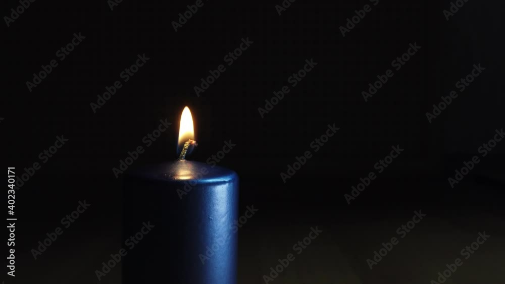 New Year's candles burn in a room in total darkness New Year's candles burn in a room in total darkness