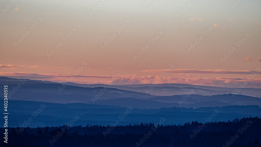 landscape with hills in blue and pink colors