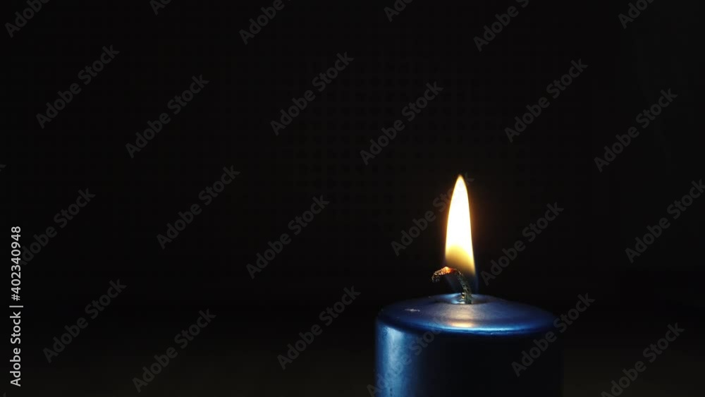 New Year's candles burn in a room in total darkness New Year's candles burn in a room in total darkness
