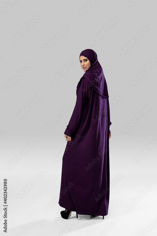 Confidence. Beautiful arab woman posing in stylish hijab isolated on studio background with copyspace for ad. Fashion, beauty, style concept. Female model with trendy make up, manicure and accessories