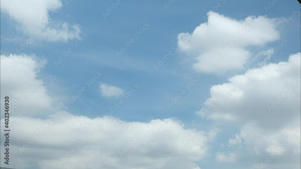 4K Time lapse. beautiful sky with clouds sunset background, Timelapse of skyscrapers, Blue sky with clouds and sun.