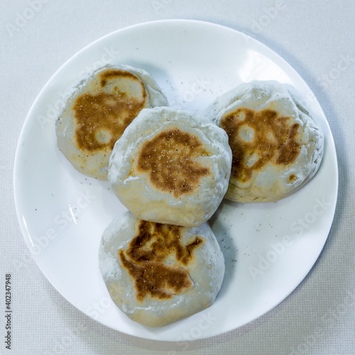 English muffin served on a white plate