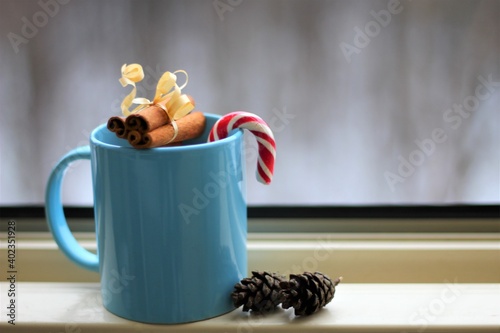 christmas mood. cup of coffee with cinnamon sticks photo