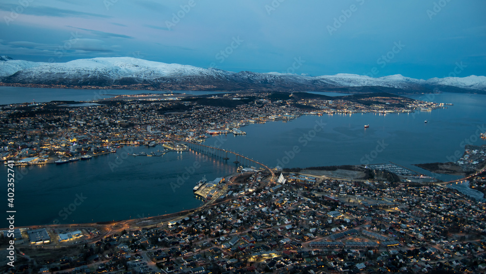 The city of Tromso in wintertime, as seen from a nearby mountain.