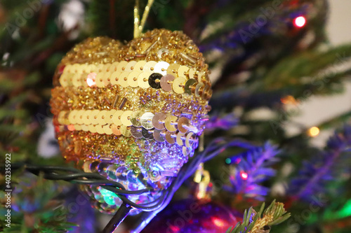Christmas tree with new year decorations. New Year celebration. Selective soft focus. Background for postcards