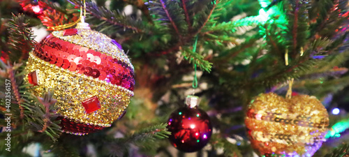 Christmas tree with new year decorations. New Year celebration. Selective soft focus. Background for postcards. Banner.