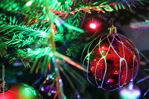 Christmas tree with new year decorations. New Year celebration. Selective soft focus. Background for postcards