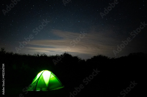 Stars in sky with enlighten camping tent - Astrophotography